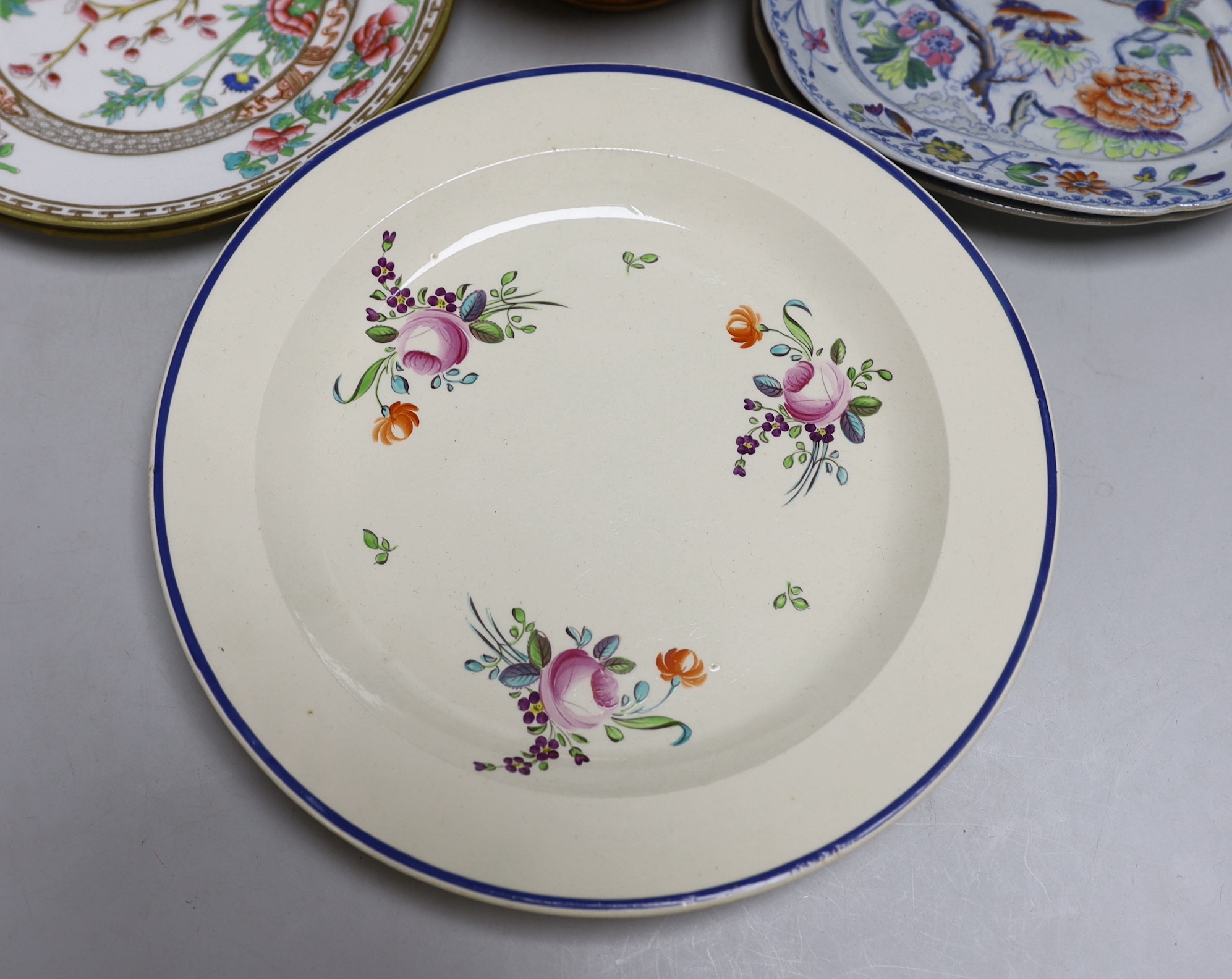 Late 18th/early 19th century: Four creamware plates painted with roses and other flowers, two Davenport small imari pattern plates, two other plates and a copper lustre jug, the largest 25cm in diameter